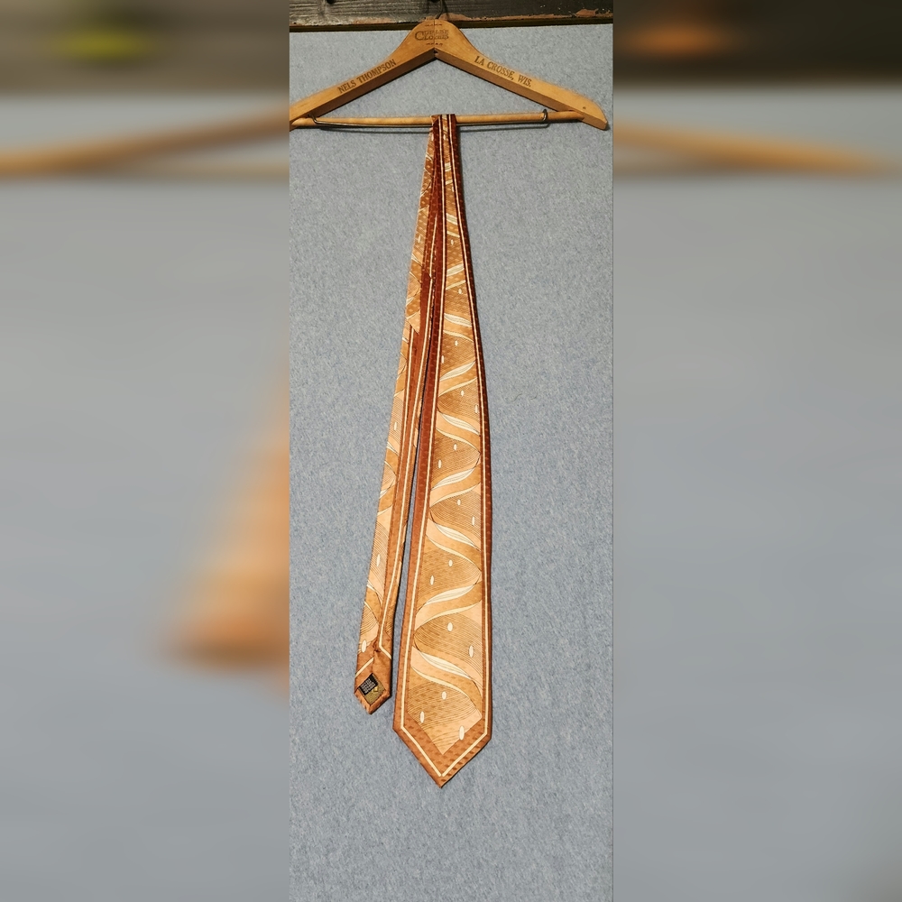 Steve Land brown ribbon print neck tie. 60" long